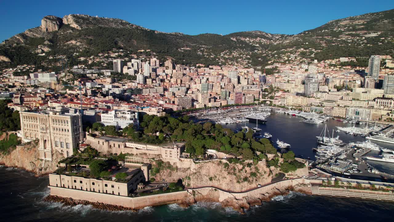Rock of Monaco, rich aerial panorama with Monte Carlo and Port Hercule in background, 4K drone shot