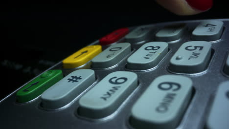 Closeup-woman-hand-using-credit-card-machine-for-money-transaction