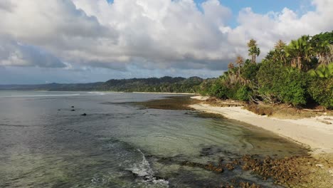 G-Land-beach-coastline-in-east-Java-Indonesia-with-rocky-shore,-Aerial-forward-lift-shot