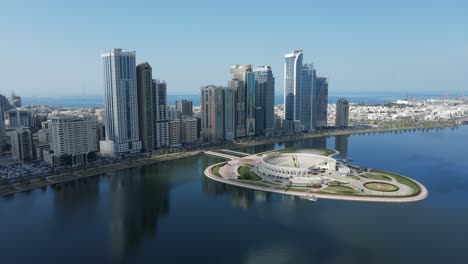 4k: sharjah from the top, aerial view of sharjah city and khalid lake, al majaz amphitheatre, travel tourism business in the united arab emirates