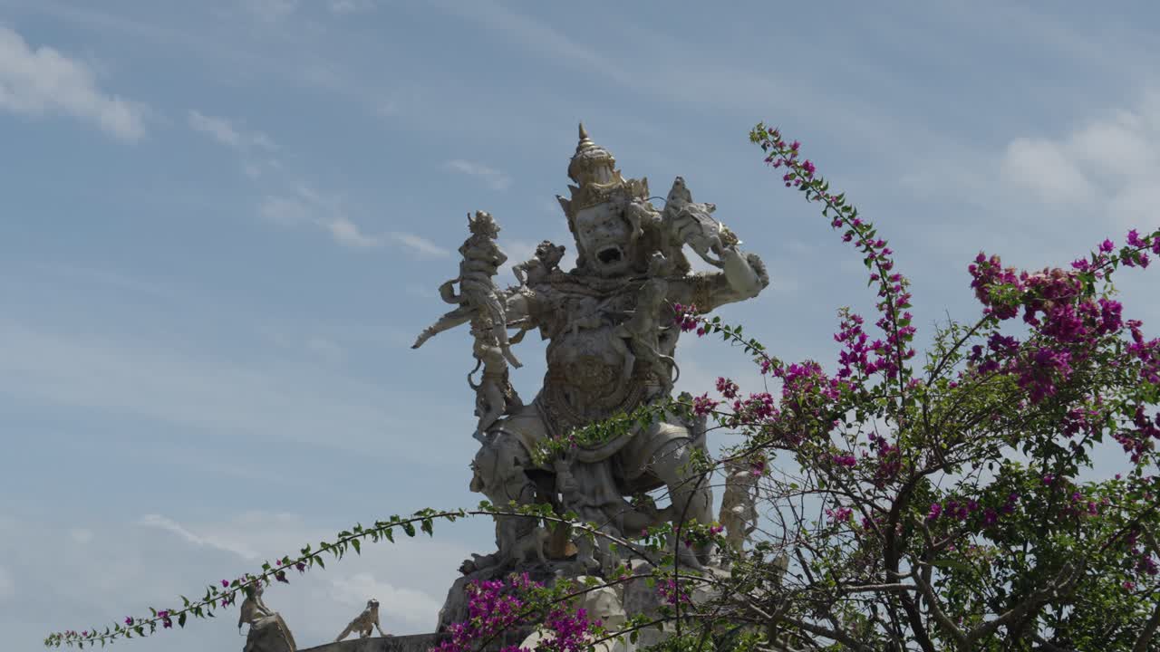 Wide shot of the White Monkey statue of the Uluwatu temple (Bali, Indonesia)