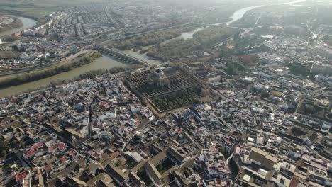 aerial wide panoramic view of cordoba city and guadalquivir river with bridge in spain