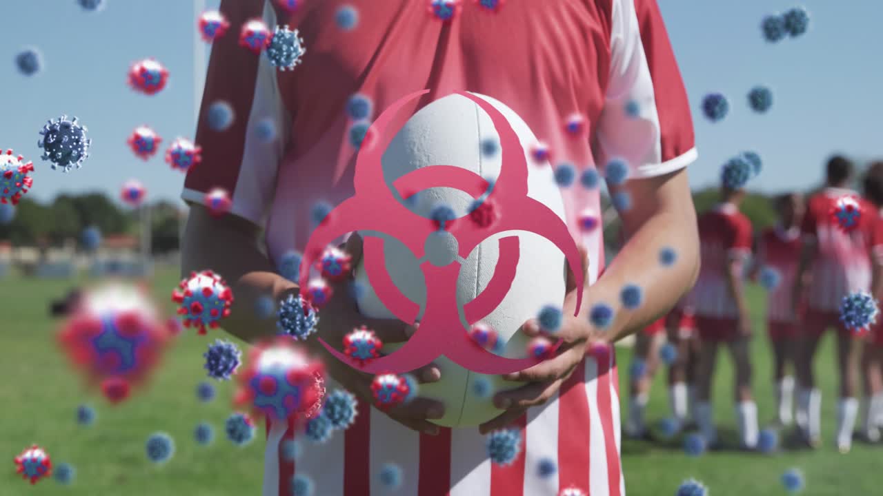Animación de células virales sobre diversos jugadores de rugby masculinos con un balón.