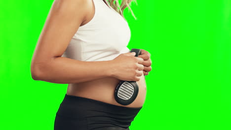 Profile,-pregnant-woman-or-headphones-on-belly