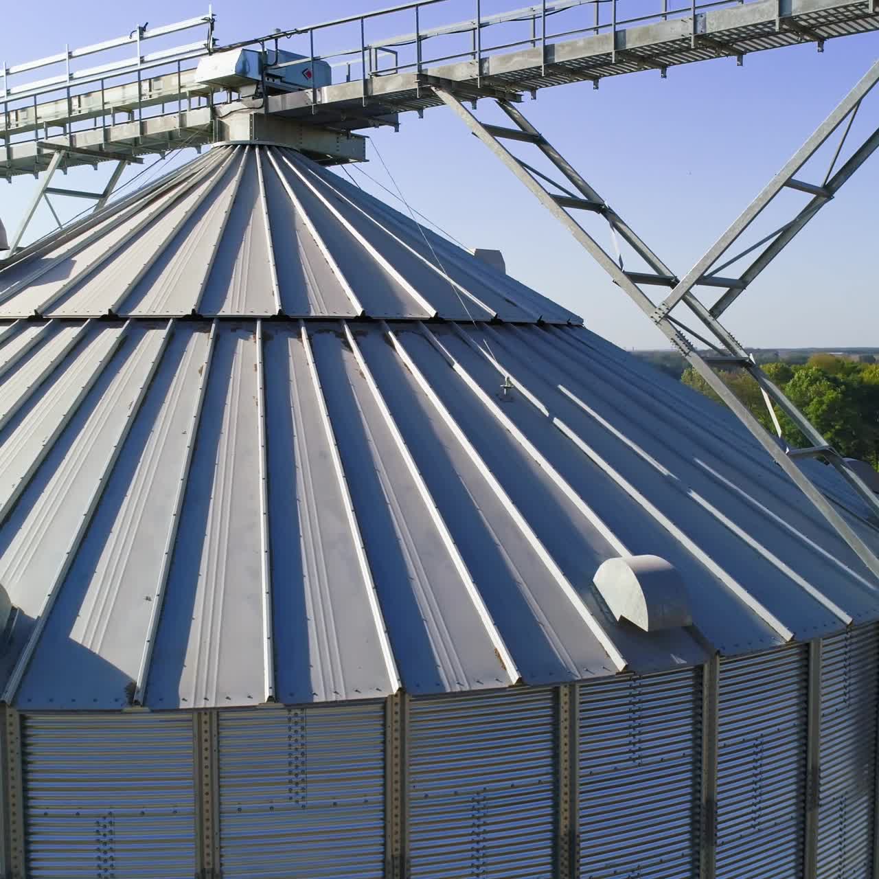Granary grain elevators. Metal tanks for the storage crop. Large bins for farming