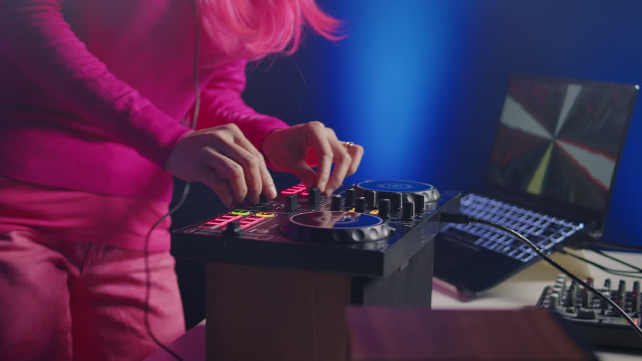 DJ mixing music with laptop