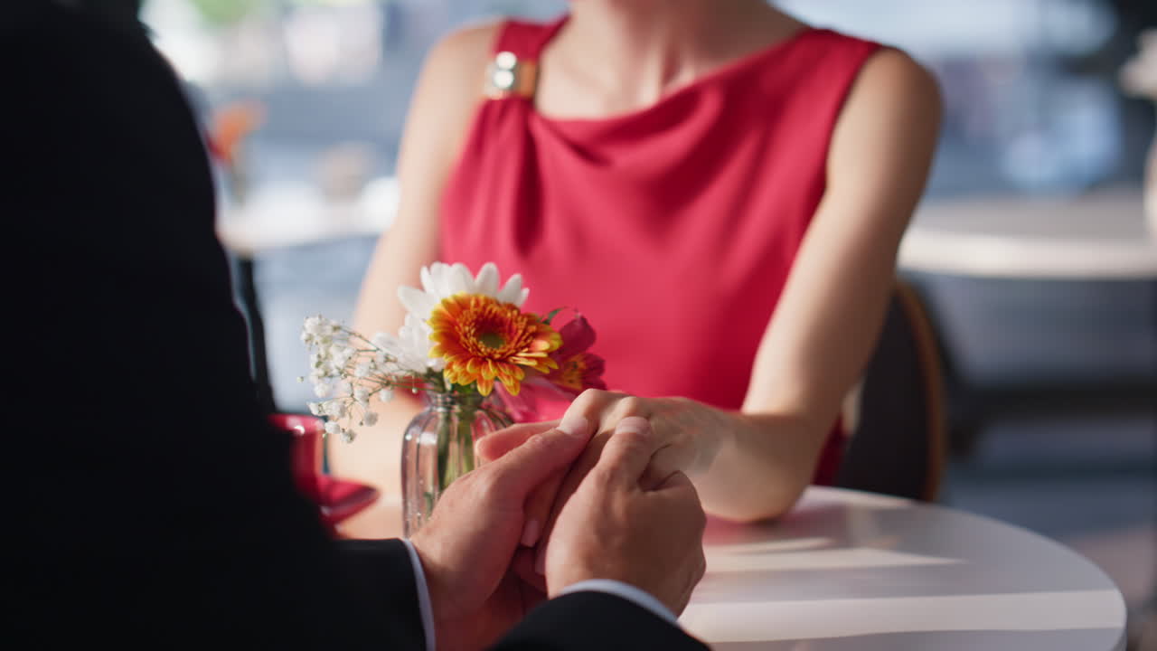 Dreamy woman looking boyfriend sitting together at cozy cafeteria closeup