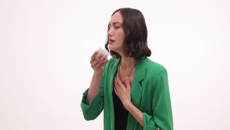 woman with a cold or flu coughing and using a tissue
