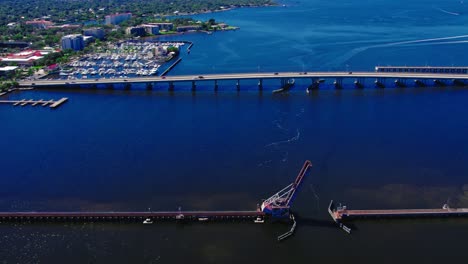 daytime aerial over the scenic waterfront of bradenton, florida, the csx train bridge stands as an engineering marvel