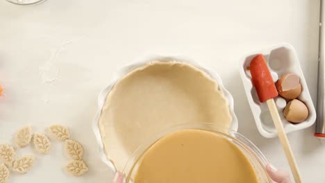 preparing traditional pumpkin pie for thanksgiving dinner.