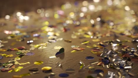 close-up view of wooden floor full of confetti