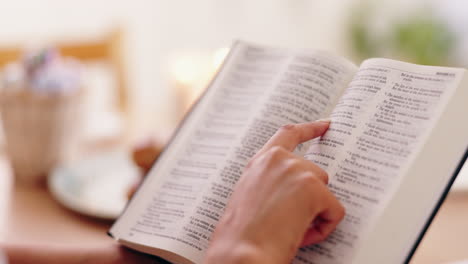 woman reading the bible by candlelight