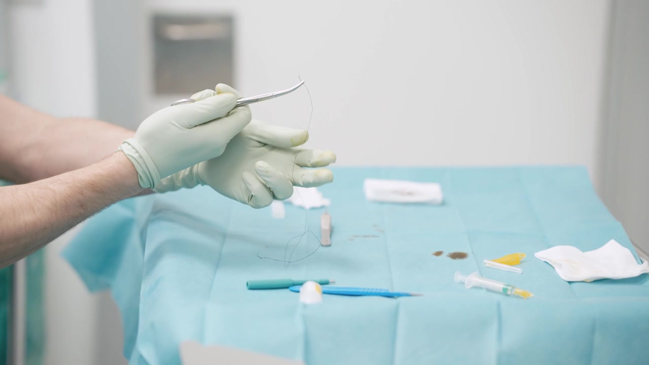 Surgeon Preparing Surgical Instruments on Sterile Tray