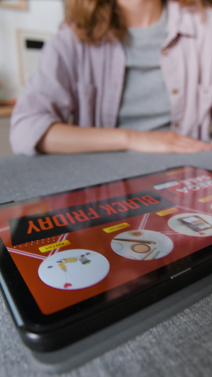 Woman shopping online during a sale on a tablet