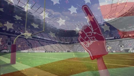 american football fan using red foam finger to support american football players and american flag w