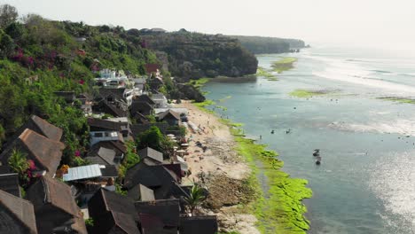 the town of bingin at the cliffs of uluwatu during low tide