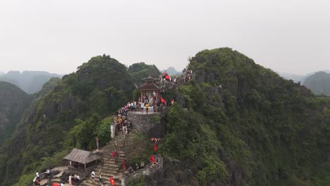 aerial drone shot of lying dragon statue on the top of the building