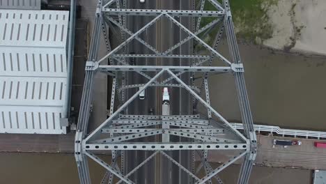 AERIAL:-Overhead-birds-eye-view-of-bridge-and-traffic