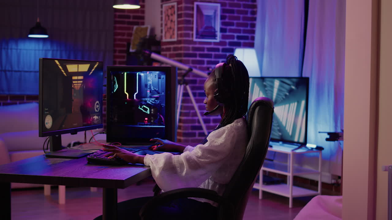 African american gamer girl streaming first person shooter tournament surprised after winning online competition