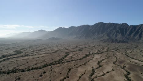 Dry-nature-and-mountains,-sunny-day-with-haze-in-Dateland,-AZ,-USA---Aerial-view