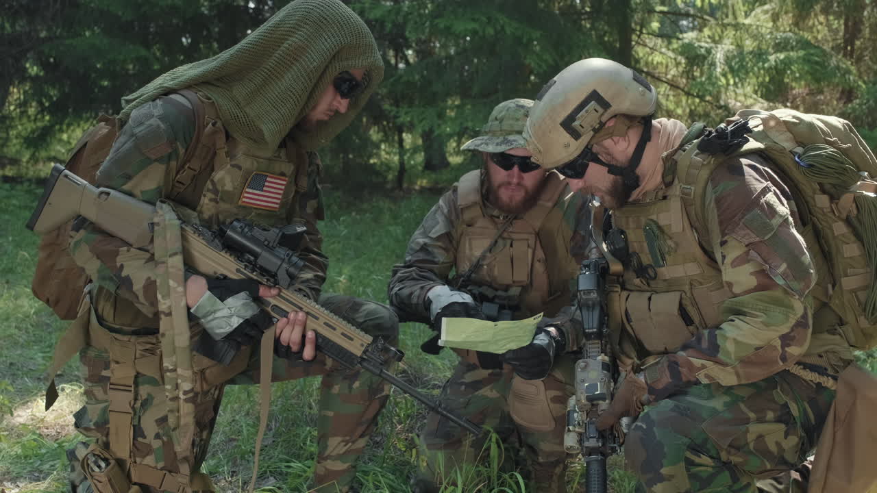 US Soldiers Looking At Map Of Area