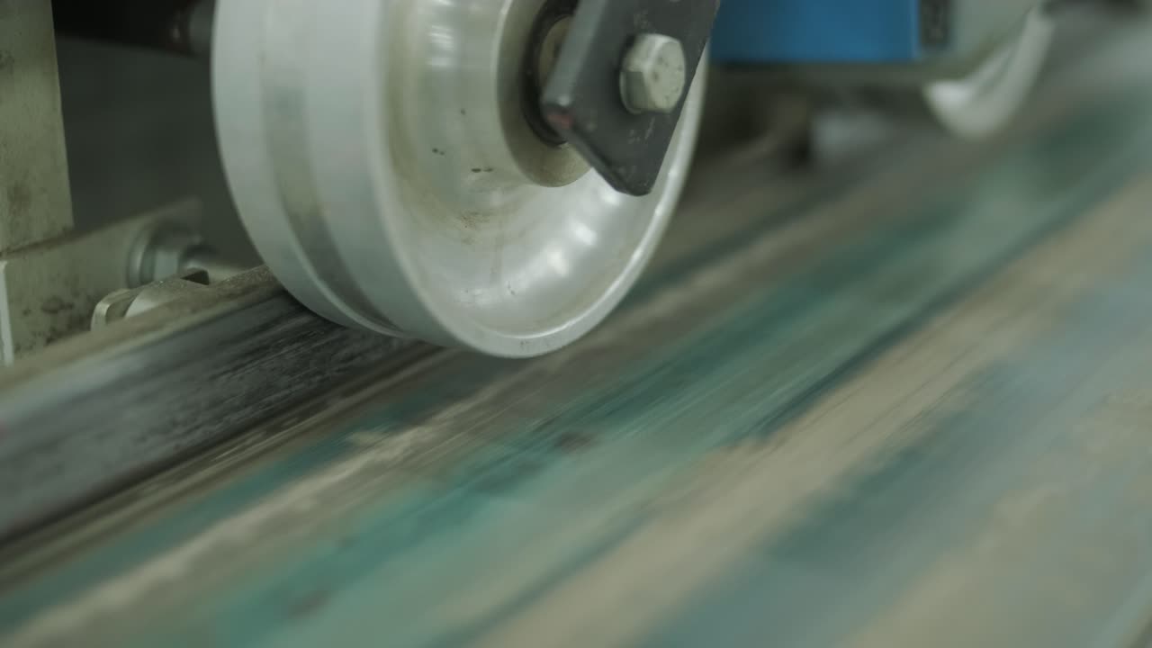 Wood Plank Moving Through Industrial Processing Machine
