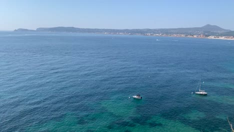 Two-Sailboats-Anchored-in-a-Bay-in-the-Mediterranean