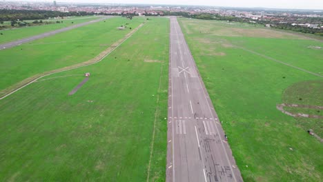 wide view of flying over airport strip