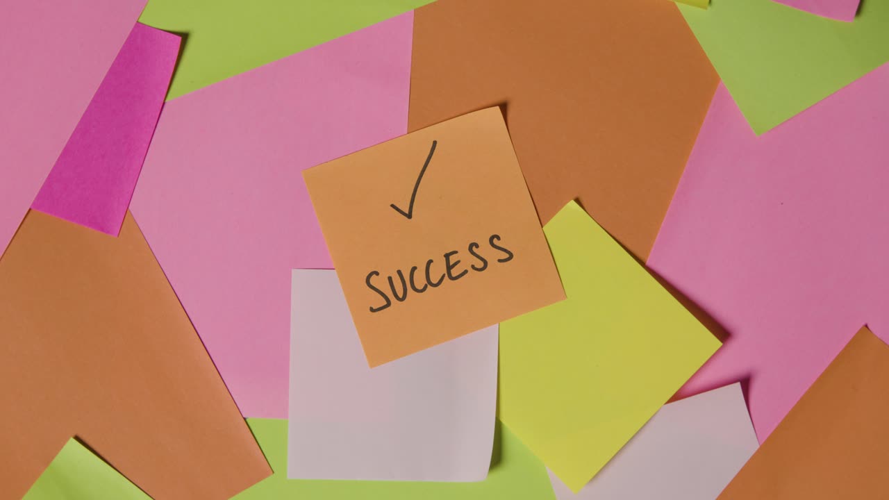 Business Concept Of Revolving Sticky Notes With Success Written On Top Note