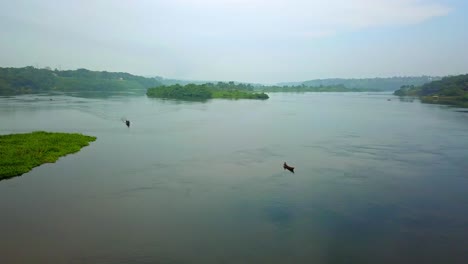 wooden boat on the nile river in jinja, uganda, africa