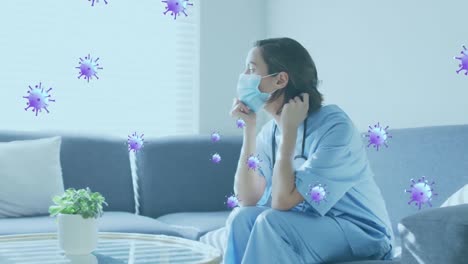 animation of virus cells over caucasian female nurse with face mask