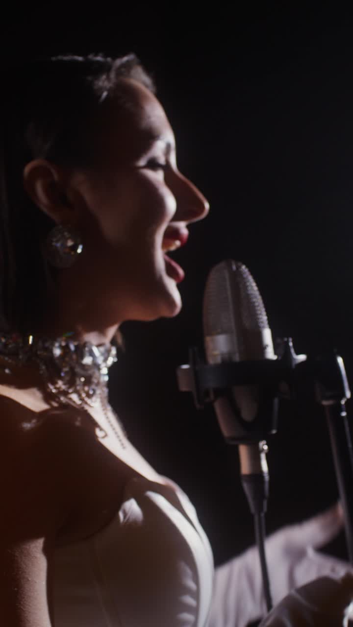 Woman Singing Into Microphone