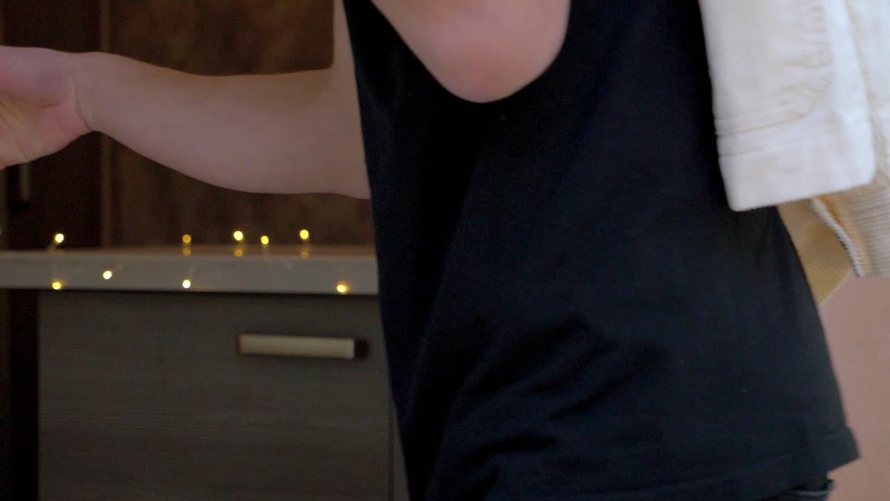 Slow motion shot of people entering a house through a doorway