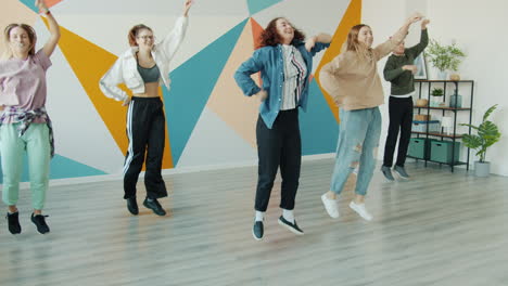 teenagers dancing in a colorful studio