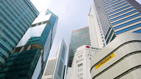 time-lapse of skyscrapers against a cloudy sky.