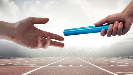 animation of athlete's hands passing relay baton over racing track in sports stadium