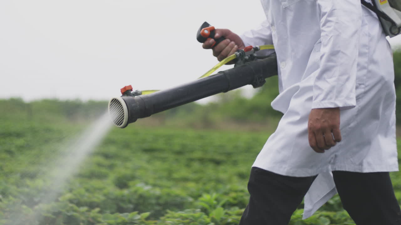 Farmer spraying crops