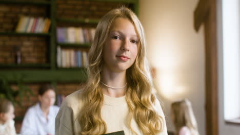 Young-teenager-holding-the-Bible-in-class