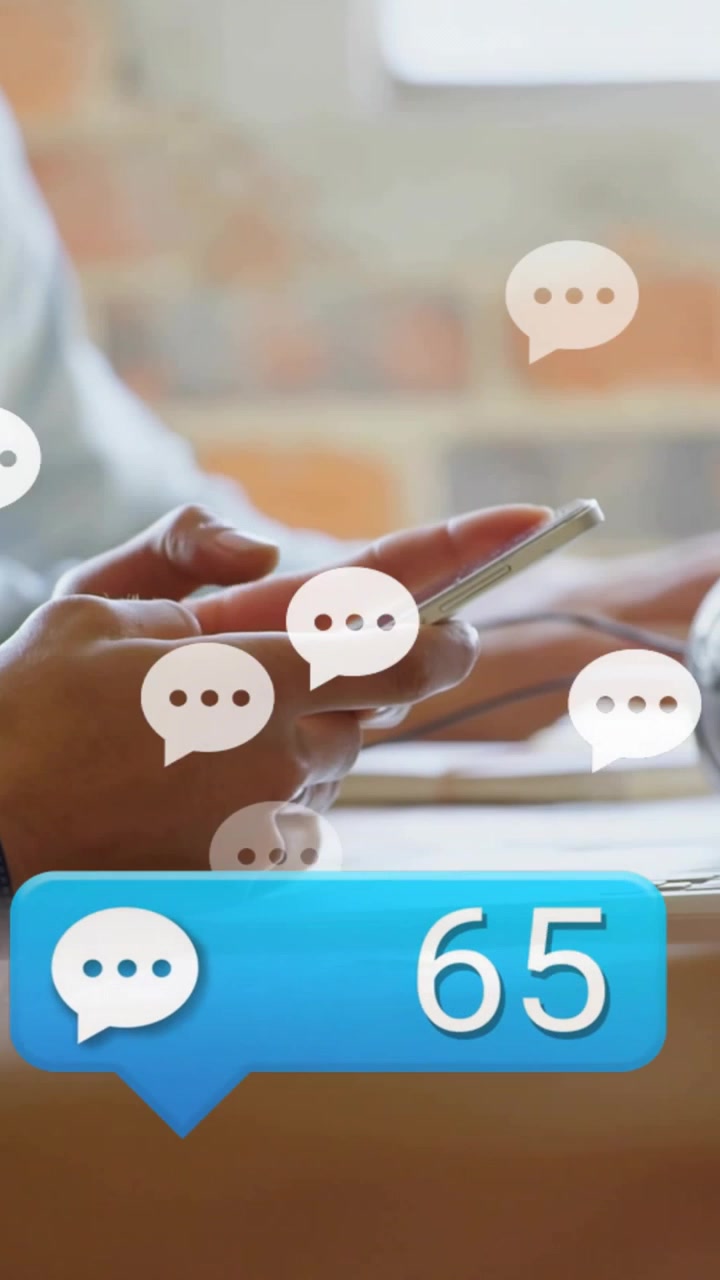 Vertical video: Woman using phone, badge growing and bubbles rising over hands, signaling work chat