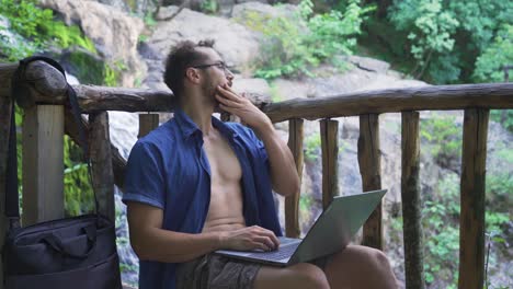 stressed office worker working with laptop outdoors.