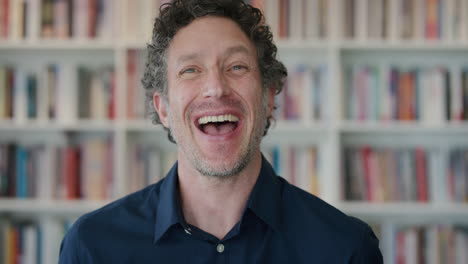 portrait-happy-mature-business-man-laughing-enjoying-success-professional-male-entrepreneur-in-bookshelf-background-slow-motion