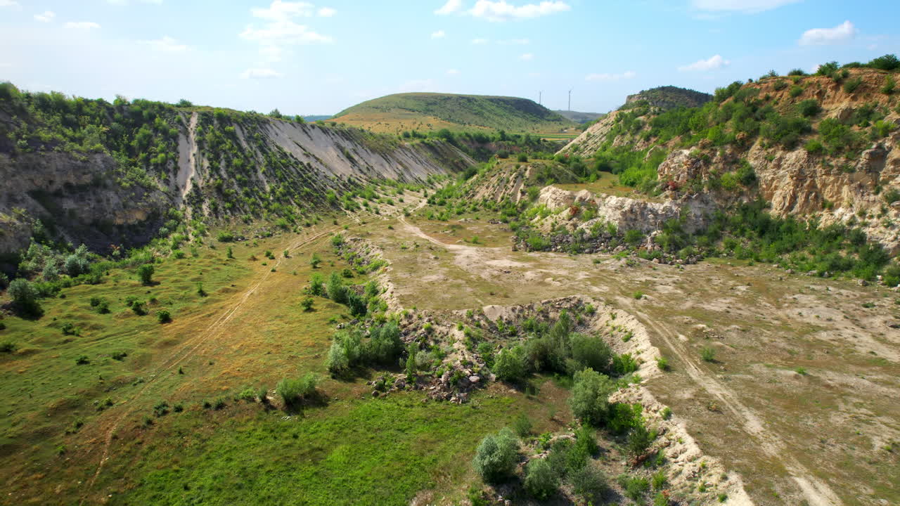Aerial drone view of the Little Switzerland of Moldova located in Fetesti. Former limestone quarry with slopes covered with greenery