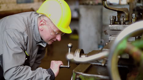 man checking machinery