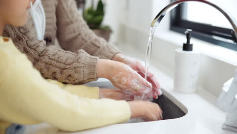 mother and child washing hands