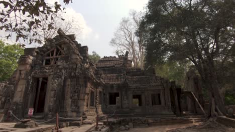 downward pan at lost temple ruin of angkor wat in the cambodian jungle