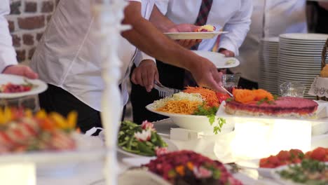 people group catering buffet food indoor in luxury restaurant with meat colorful fruits and vegetables.