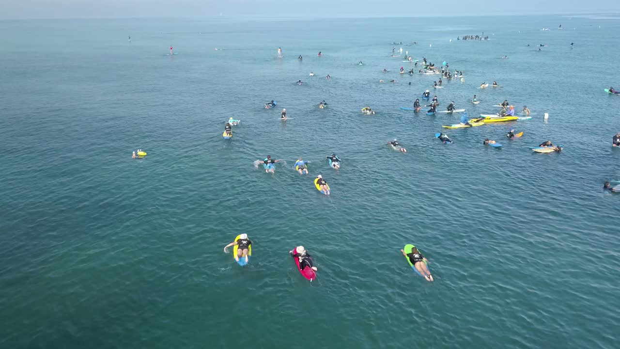 People Surfing in the Ocean