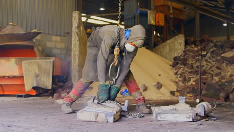 worker operating crane in foundry workshop 4k