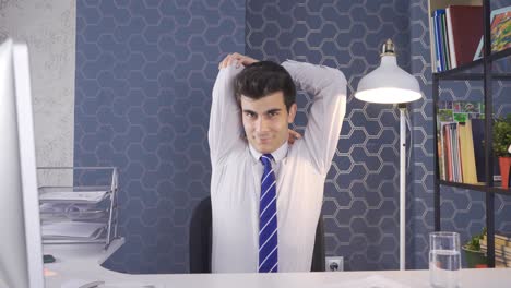 Young-businessman-exercising-in-the-office.