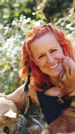 joyful woman and her dogs outdoors